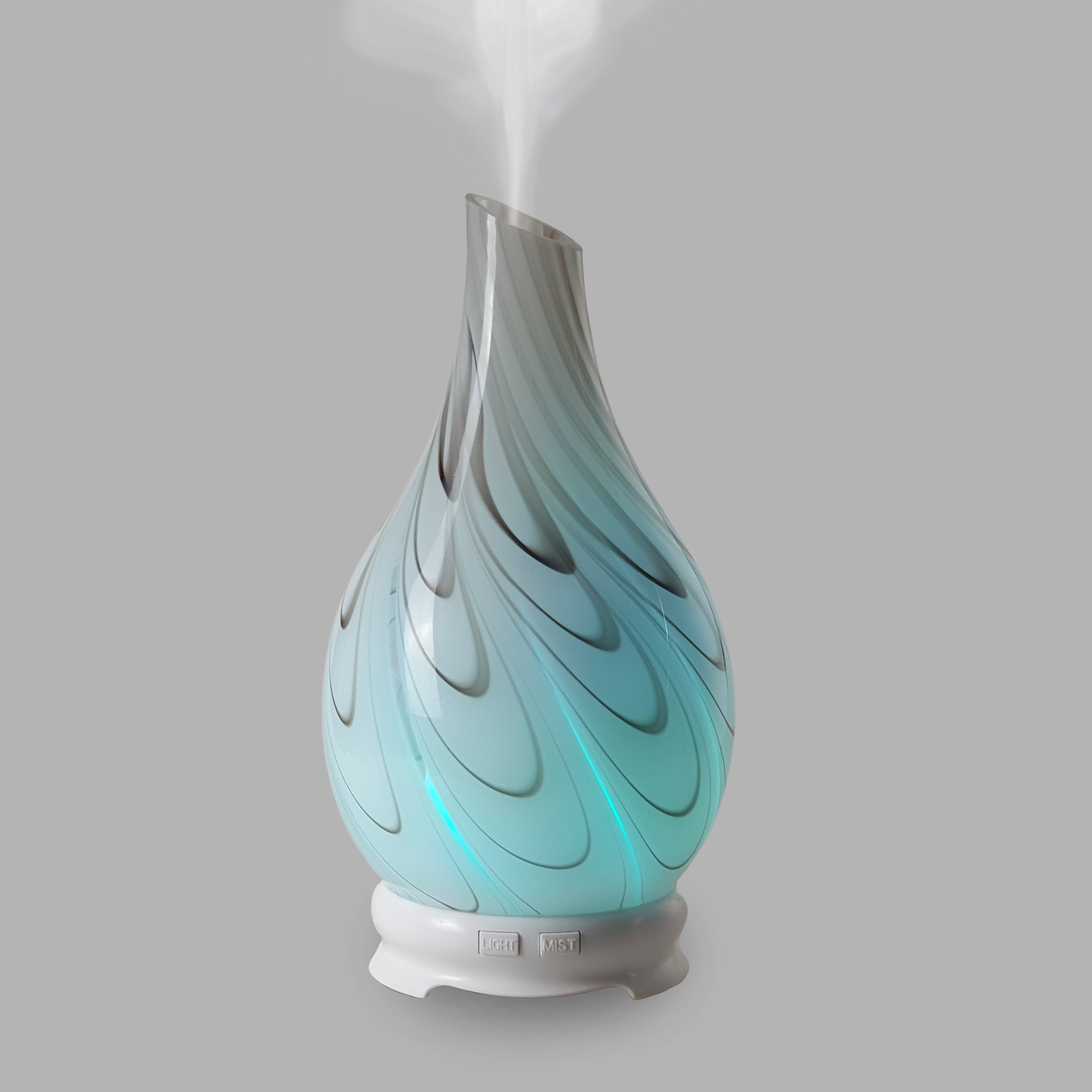 This Galaxy Swirl essential oil diffuser brings a modern look to any room with its swirling blend of red and brown.