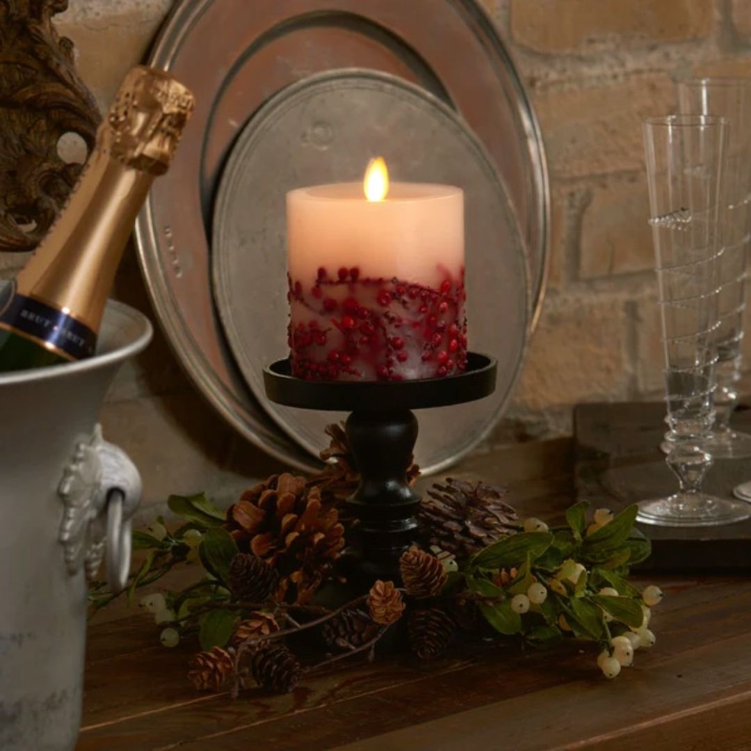 This Luminara Red Berry Inclusions Flameless Pillar is the fashion-forward centerpiece for all your candle décor needs. We selected this modern melted design to showcase the dancing Real-Flame Effect from all angles, ensuring endless decorating possibilities!