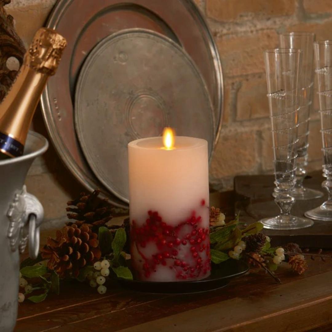 This Luminara Red Berry Inclusions Flameless Pillar is the fashion-forward centerpiece for all your candle décor needs. We selected this modern melted design to showcase the dancing Real-Flame Effect from all angles, ensuring endless decorating possibilities!